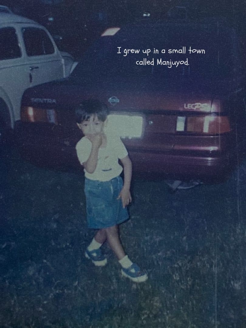 Godfrey as a child at night, standing between two parked cars in Manjuyod