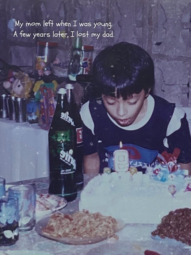 Godfrey as a boy, blowing out the candles on a birthday cake