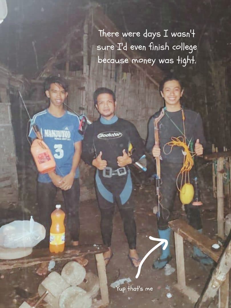 Godfrey and two friends in wetsuits with spearfishing gear, at night