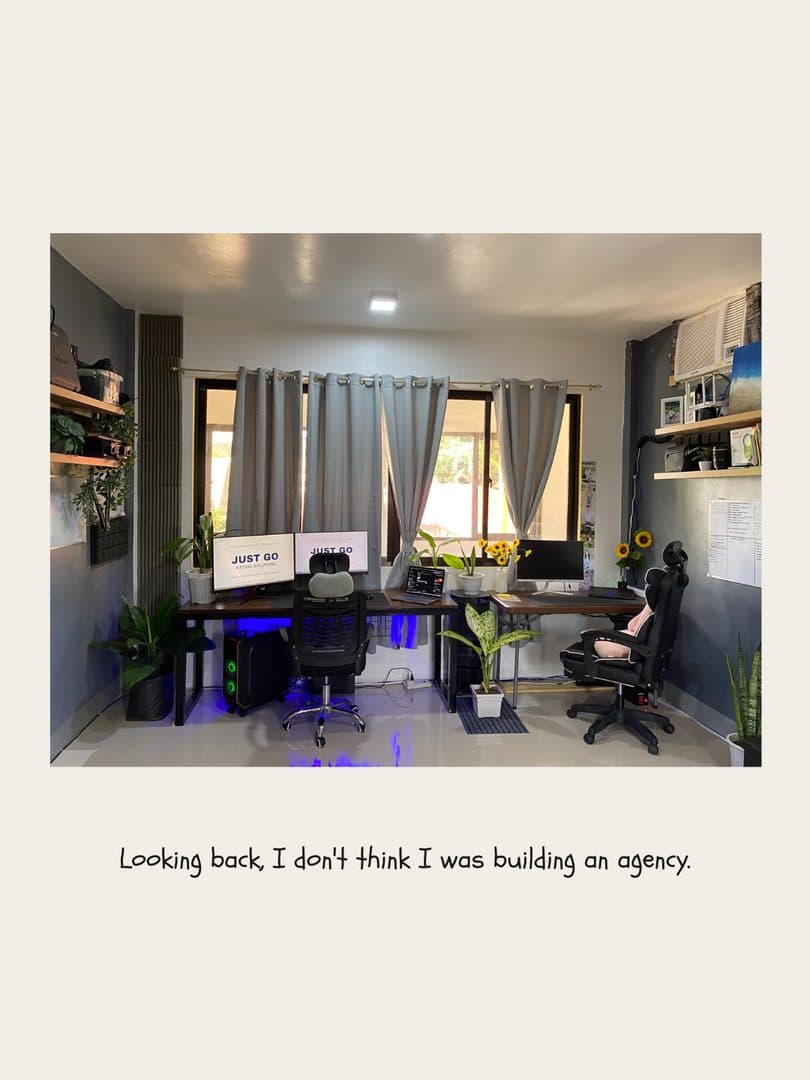 The first JustGo office: two desks, two monitors, plants and sunflowers
