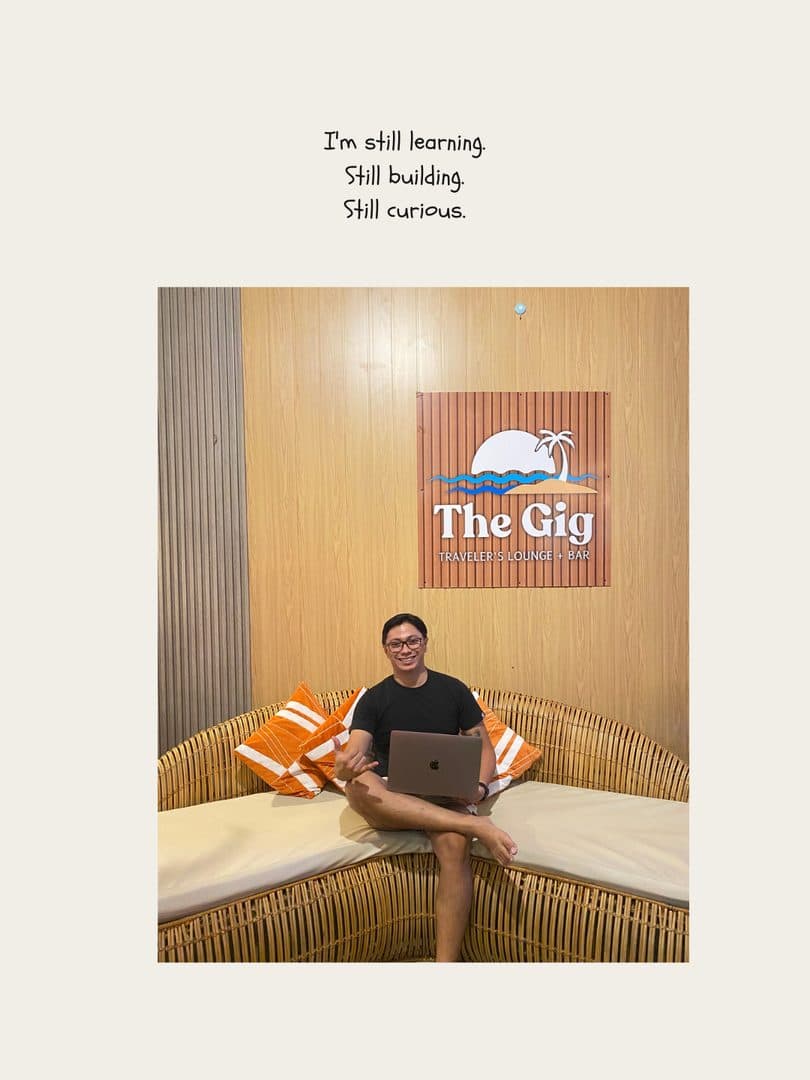 Godfrey working from a sofa at The Gig traveler’s lounge
